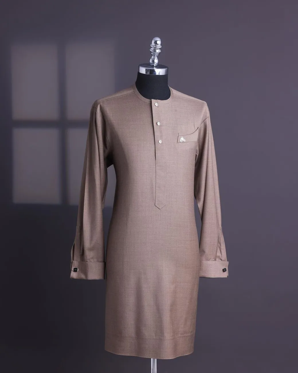 A Light brown, jorgecarli fabric, front flap with silver Swarovski button, long sleeve African senator kaftan native.