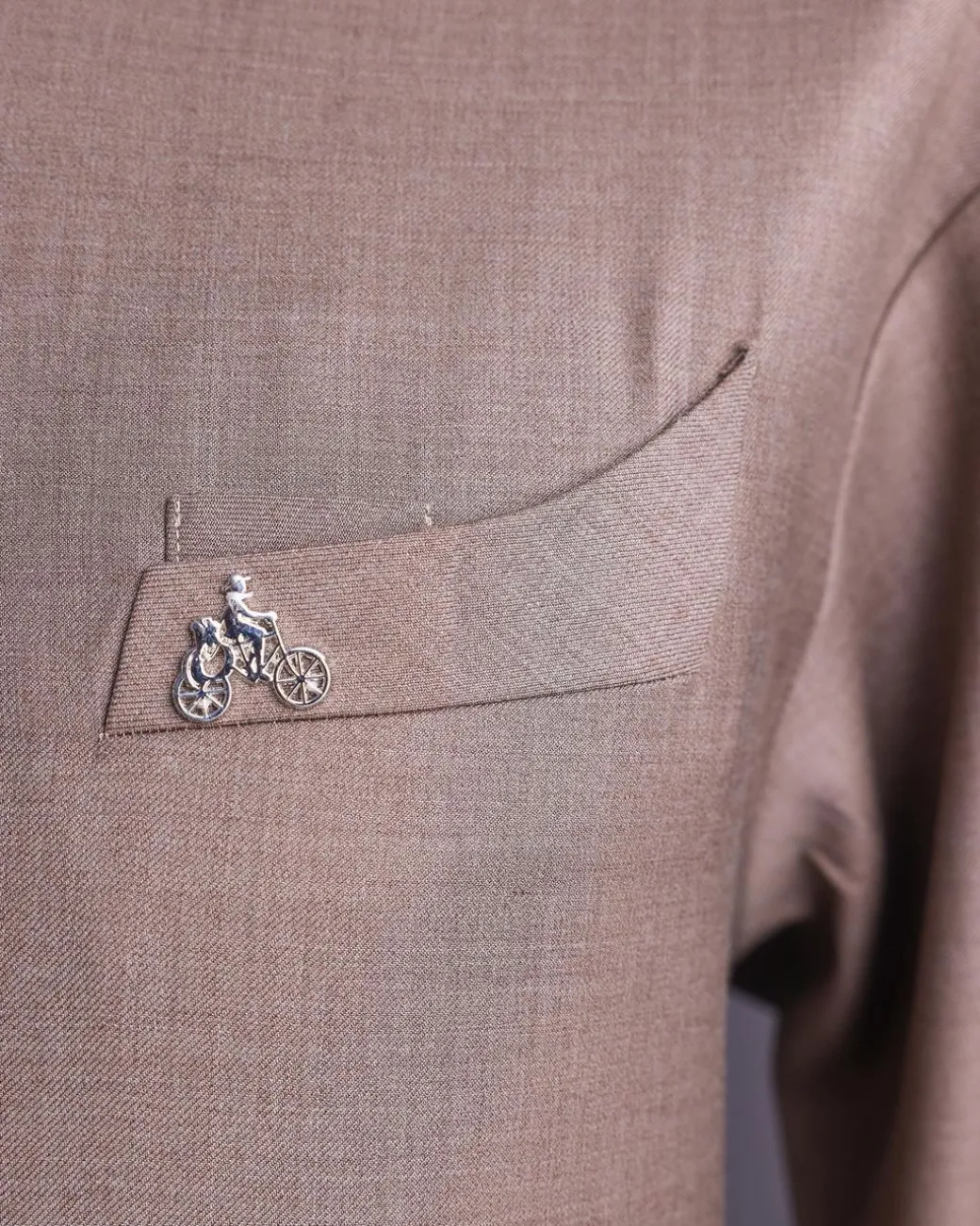 A Light brown, jorgecarli fabric, front flap with silver Swarovski button, long sleeve African senator kaftan native.
