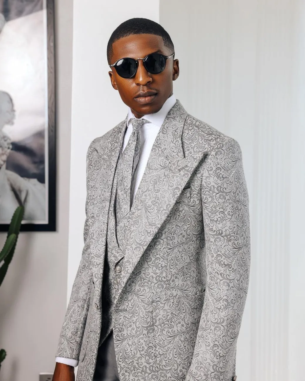 A Light grey & black floral jacquard peak lapel suit.