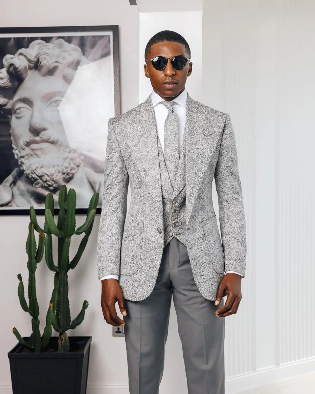 A Light grey & black floral jacquard peak lapel suit.