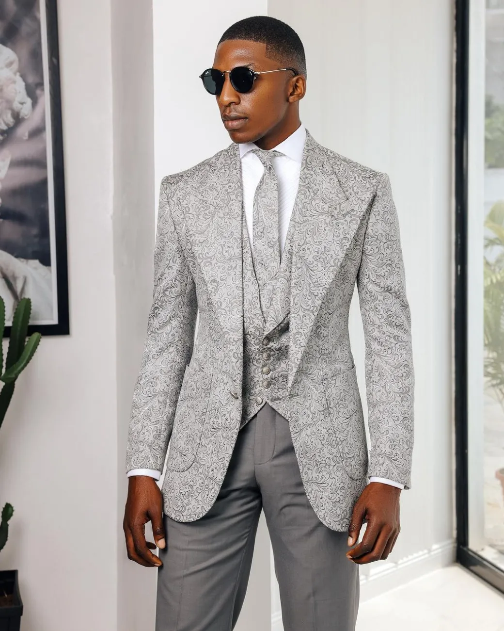 A Light grey & black floral jacquard peak lapel suit.