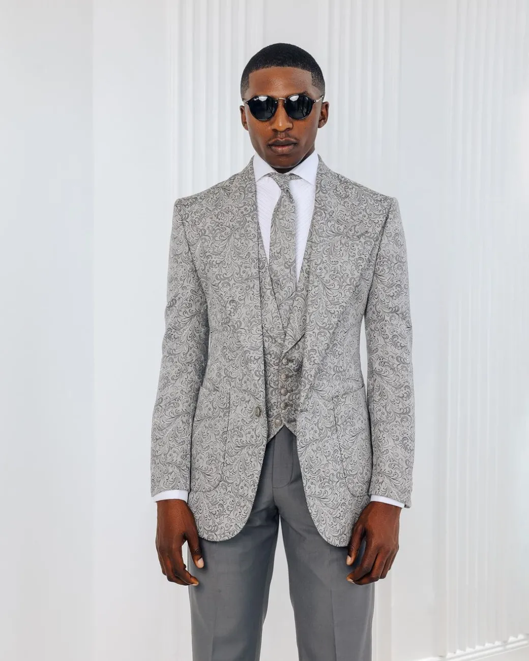 A Light grey & black floral jacquard peak lapel suit.