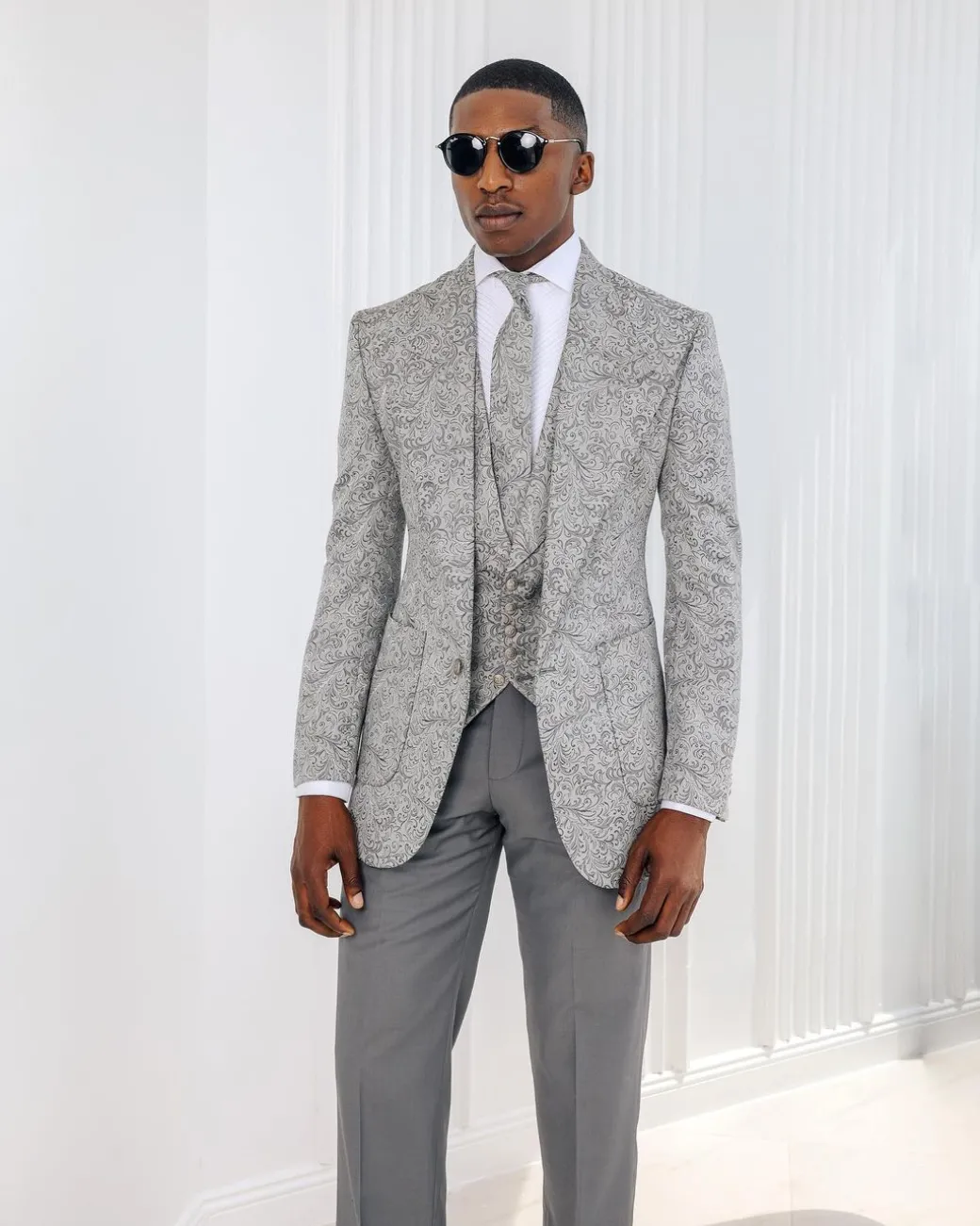 A Light grey & black floral jacquard peak lapel suit.