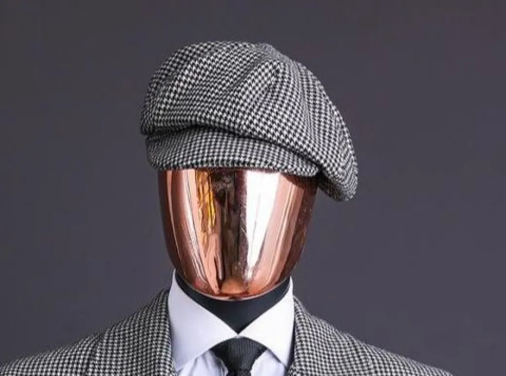 A Light Grey And Black Mix Of Houndstooth Check Hat.