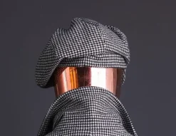 A Light Grey And Black Mix Of Houndstooth Check Hat.
