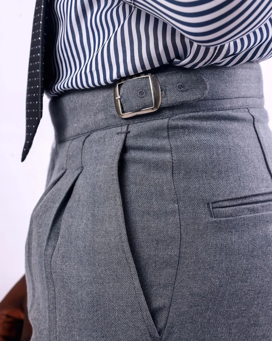 A Light grey, double pleat with side metal adjuster Gurkha pant