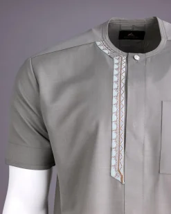 A Light grey, front flap with silver studded Swarovski buttons, left drop Arewa embroidery, short sleeve African senator kaftan native
