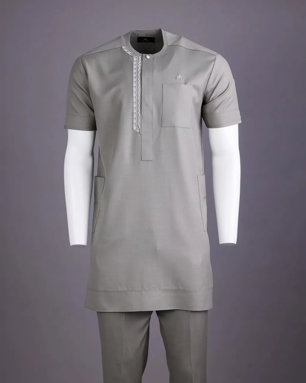A Light grey, front flap with silver studded Swarovski buttons, left drop Arewa embroidery, short sleeve African senator kaftan native