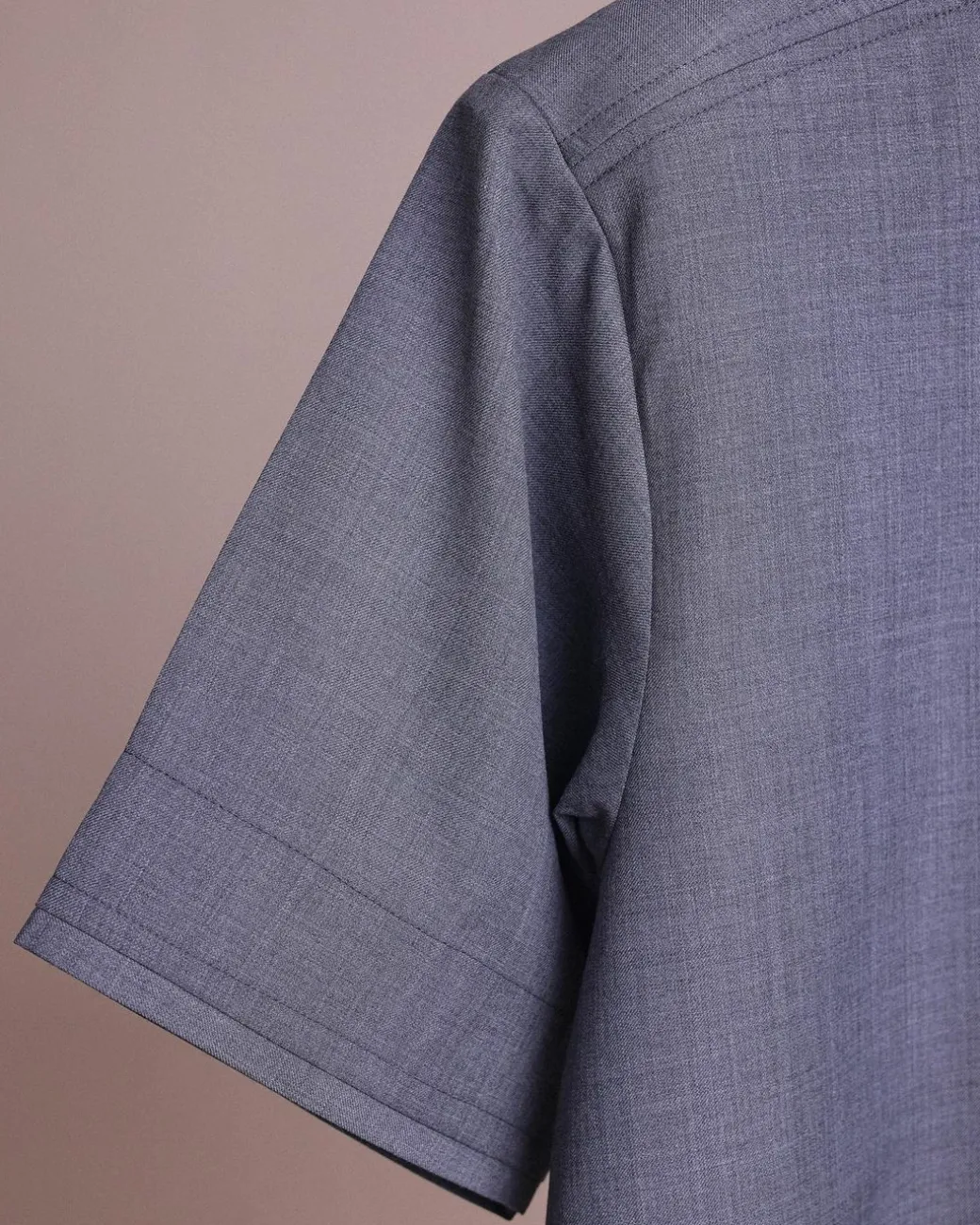 A Light grey, front flap with matching Swarovski button details, short sleeve African senator kaftan native.