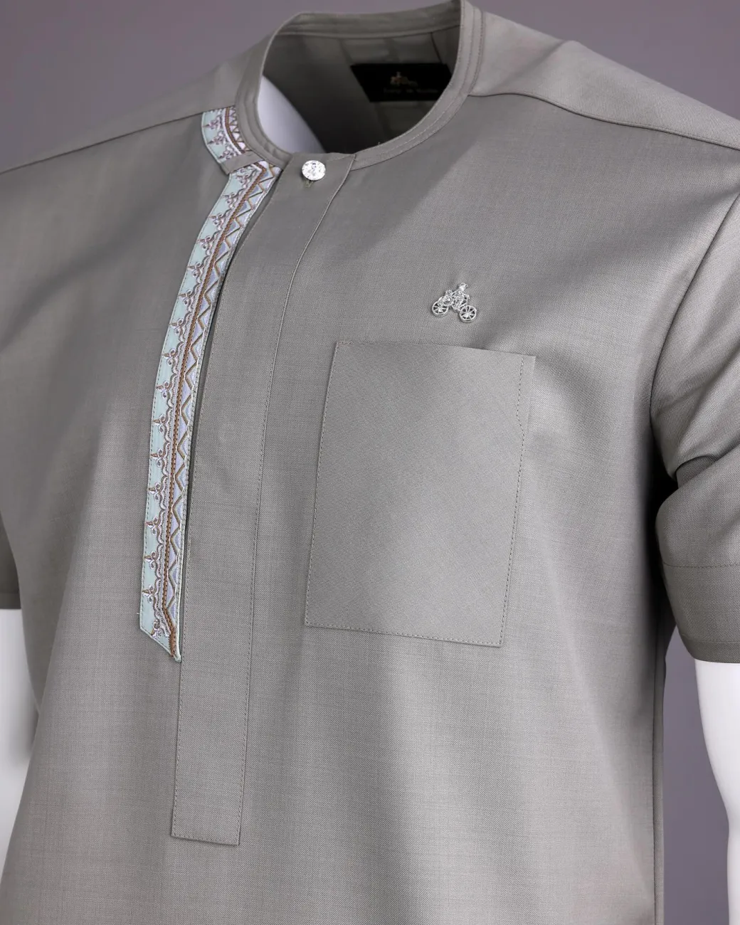 A Light grey, front flap with silver studded Swarovski buttons, left drop Arewa embroidery, short sleeve African senator kaftan native