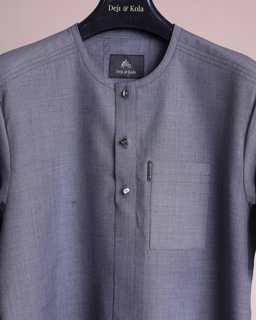 A Light grey, front flap with matching Swarovski button details, short sleeve African senator kaftan native.