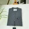 A light grey stripe front flap, Swarovski stone button with a maze line design African kaftan