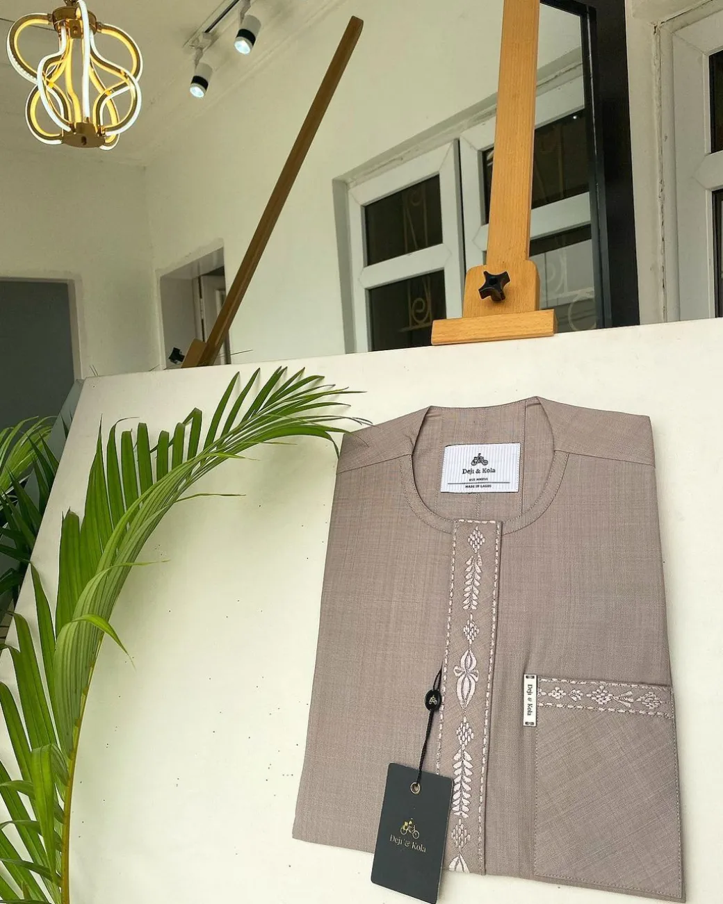 A light lilac senator African kaftan with a dispersed connected embroidery design
