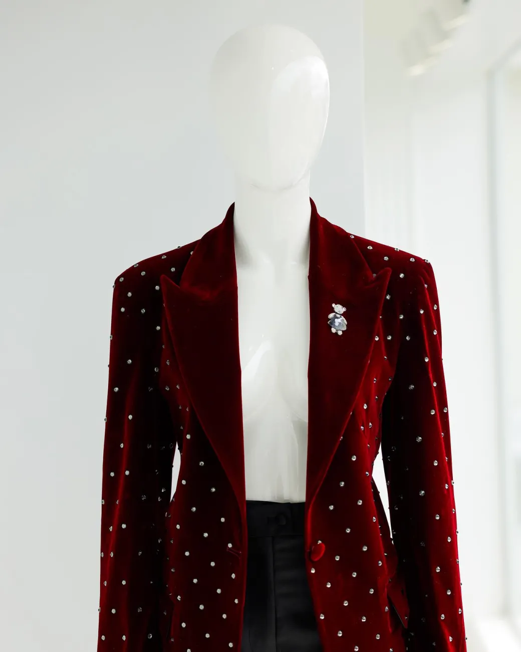 A Lipstick Red, Soaked Velvet Peak Lapel Suit.
