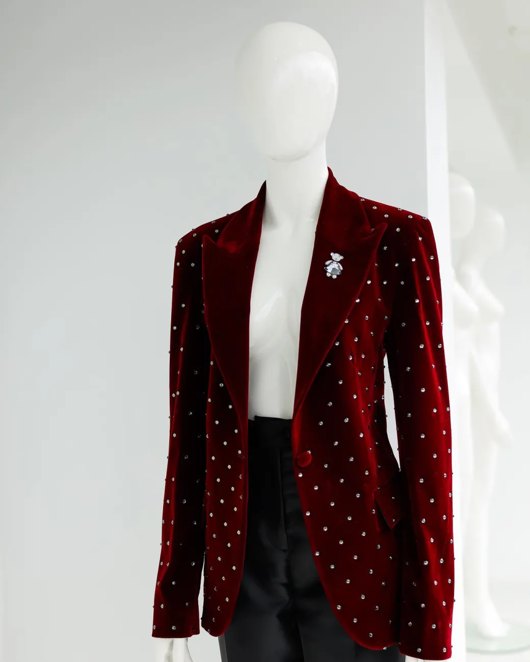 A Lipstick Red, Soaked Velvet Peak Lapel Suit.
