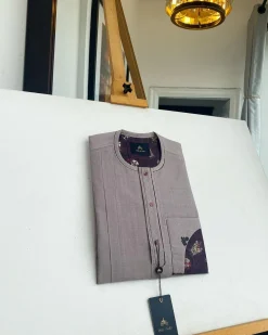A liver brown, curved reverse pocket, front flap with purple Swarovski African kaftan native