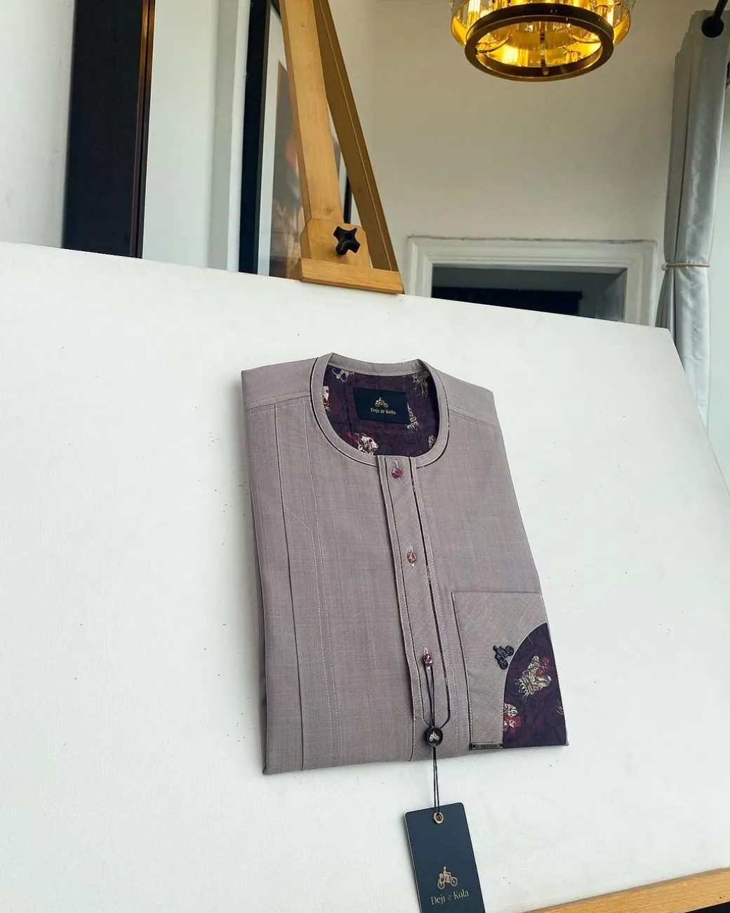 A liver brown, curved reverse pocket, front flap with purple Swarovski African kaftan native