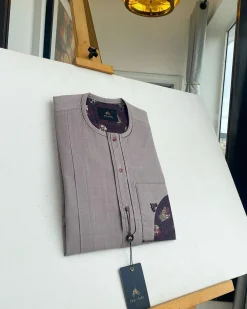 A liver brown, curved reverse pocket, front flap with purple Swarovski African kaftan native