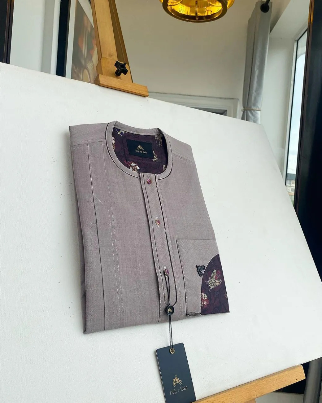 A liver brown, curved reverse pocket, front flap with purple Swarovski African kaftan native