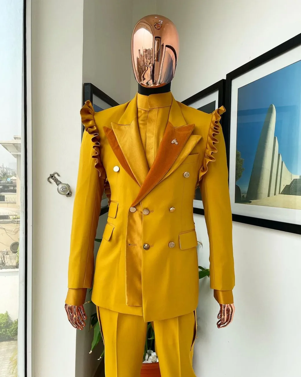 A “Made in Lagos” Wing Flare, Quad peak lapel, triple breasted metallic jacquard blazer suit