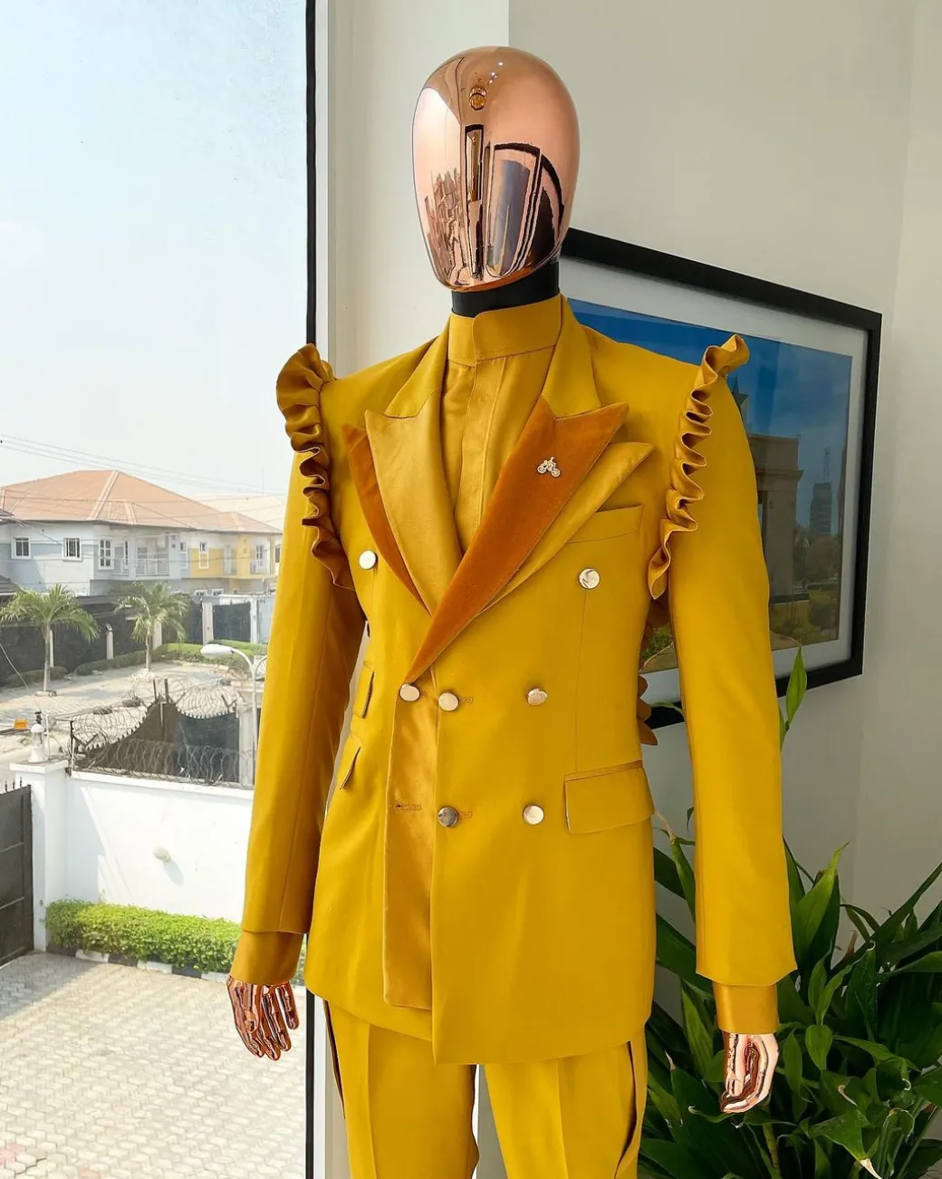 A “Made in Lagos” Wing Flare, Quad peak lapel, triple breasted metallic jacquard blazer suit