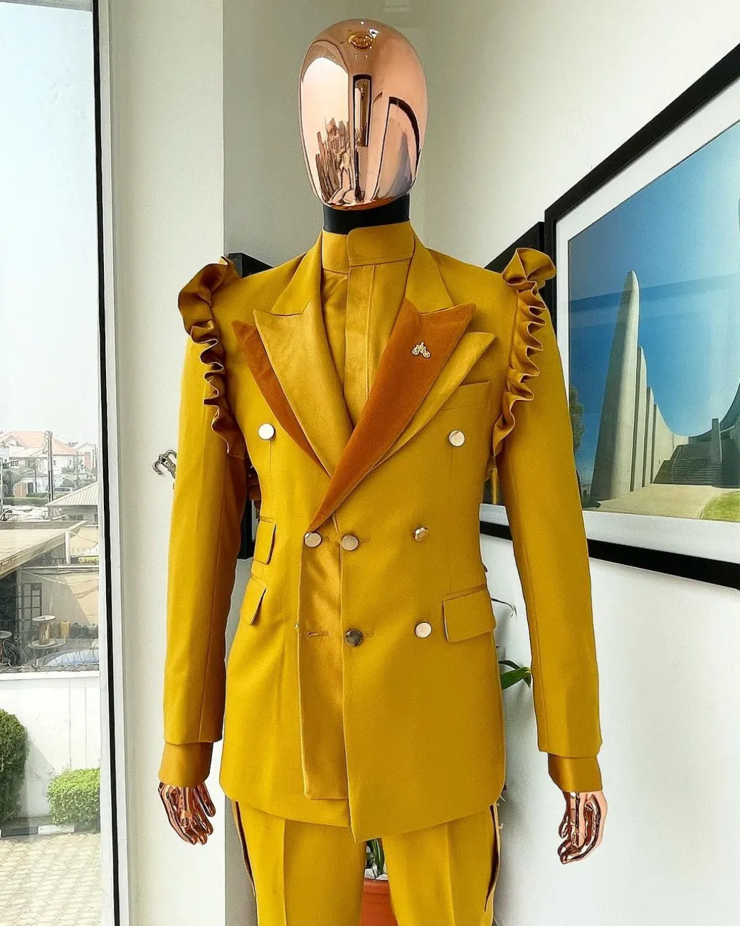 A “Made in Lagos” Wing Flare, Quad peak lapel, triple breasted metallic jacquard blazer suit