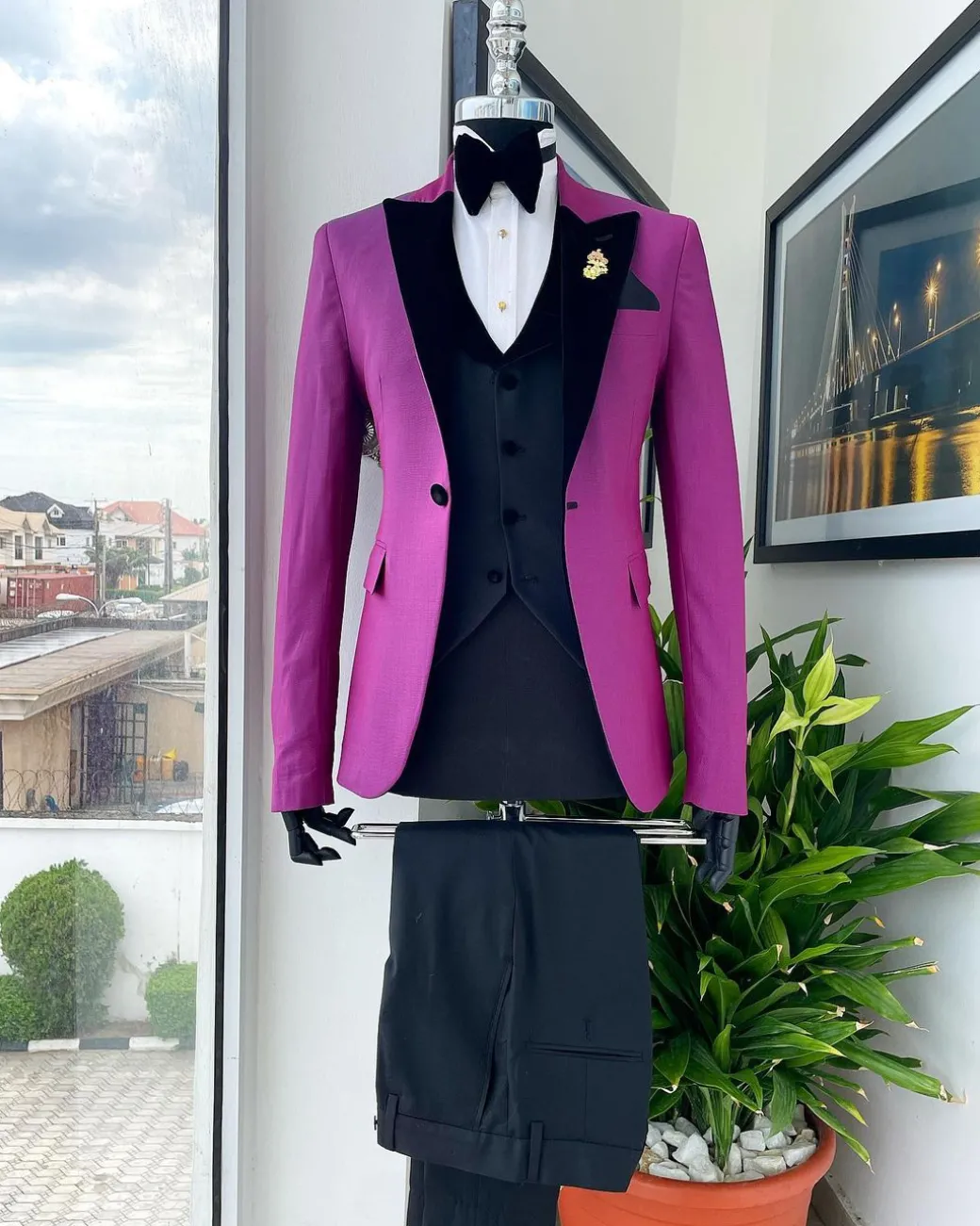 A Magenta, one button, peak lapel tuxedo jacquard suit.