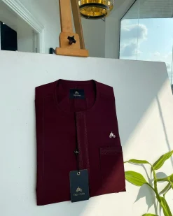 A mahogamy red, spiral layered flap and pocket embroidery detailing african traditional senator kaftan native.