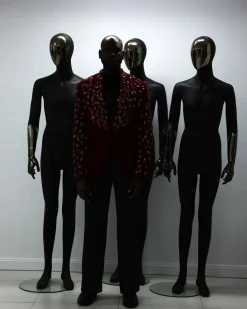 A Mahogany red shawl lapel tuxedo with black and octagonal laser-cut matching Swarovski stones suit