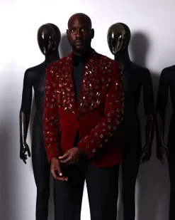 A Mahogany red shawl lapel tuxedo with black and octagonal laser-cut matching Swarovski stones suit