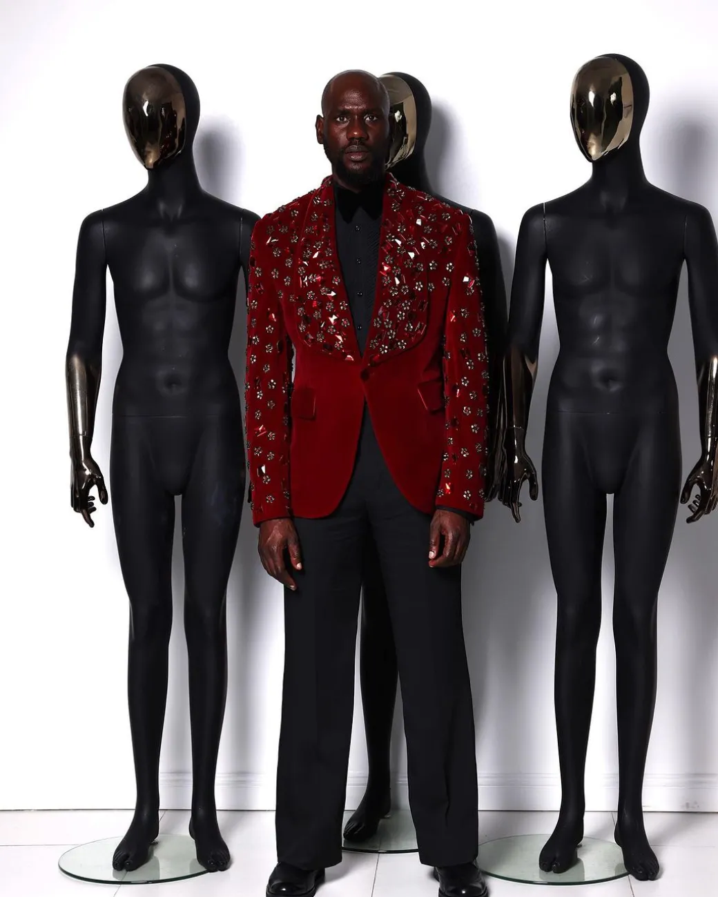 A Mahogany red shawl lapel tuxedo with black and octagonal laser-cut matching Swarovski stones suit