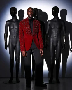 A Mahogany red shawl lapel tuxedo with black and octagonal laser-cut matching Swarovski stones suit