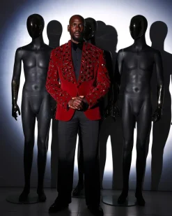 A Mahogany red shawl lapel tuxedo with black and octagonal laser-cut matching Swarovski stones suit