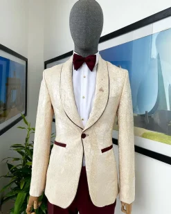 A “Mandarin” dispersed gold ruffle pattern burgundy shawl lapel jacquard suit
