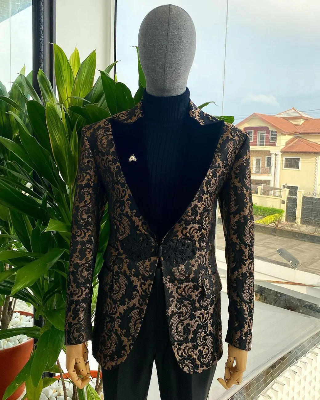 A “Mandarin” Peak Lapel with black soaked Italian velvet, Chinese button suit