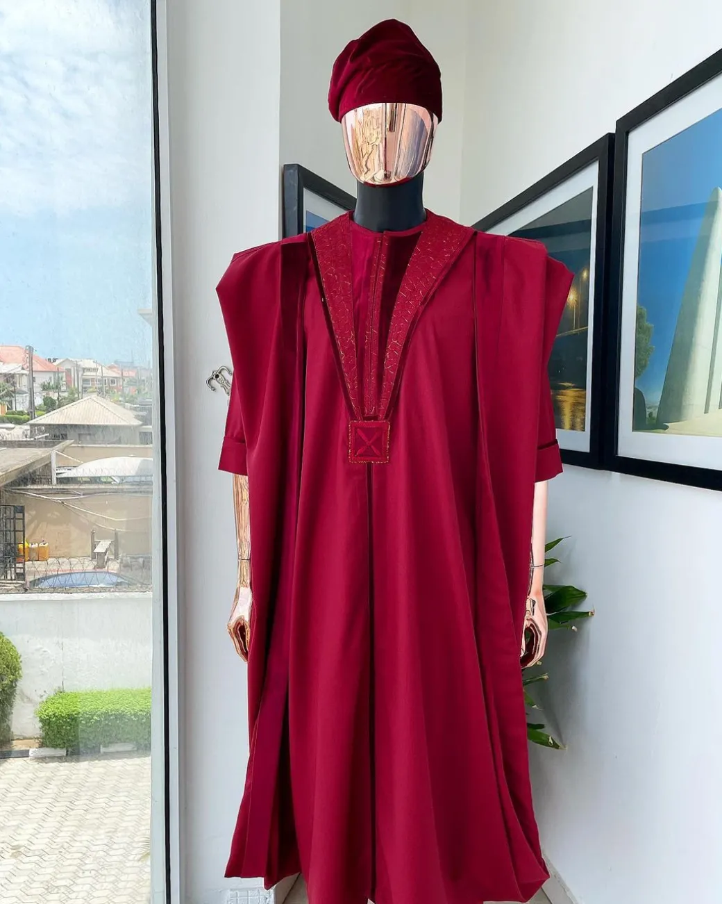 A Maroon red, vehicular lapelled with closed line flap and marching velvet mix embroidery design agbada