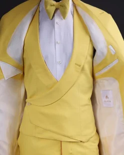A Middle yellow linen shawl lapel jacket, cross cut unbalanced wrapped waistcoat, bow tie & Gurkha pant Trouser
