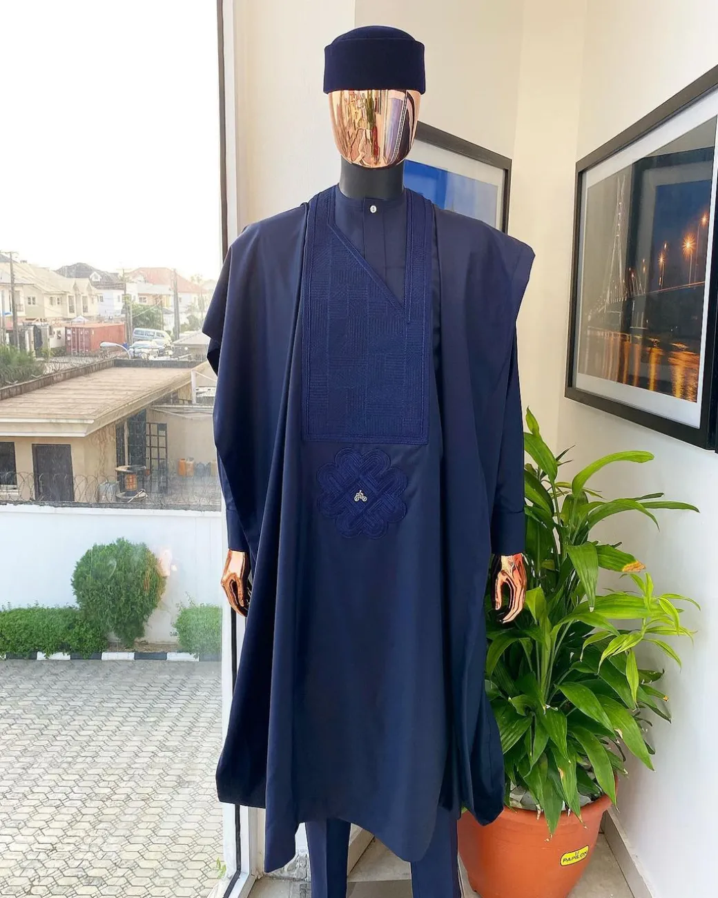 A Midnight Blue Agbada with a maze line Japanese intersection design, senator kaftan with Swarovski button details and sokoto