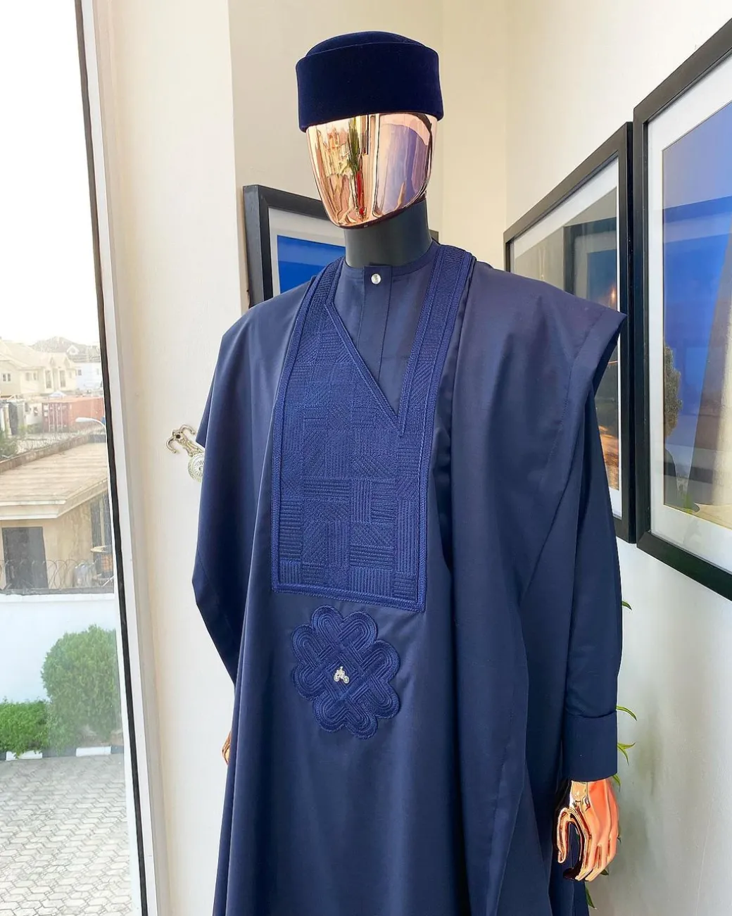 A Midnight Blue Agbada with a maze line Japanese intersection design, senator kaftan with Swarovski button details and sokoto