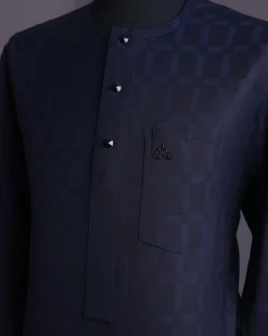 A Midnight blue, broken rectangle and square pattern, jorgecarli, front flap with black Swarovski button, long sleeve African senator kaftan native.