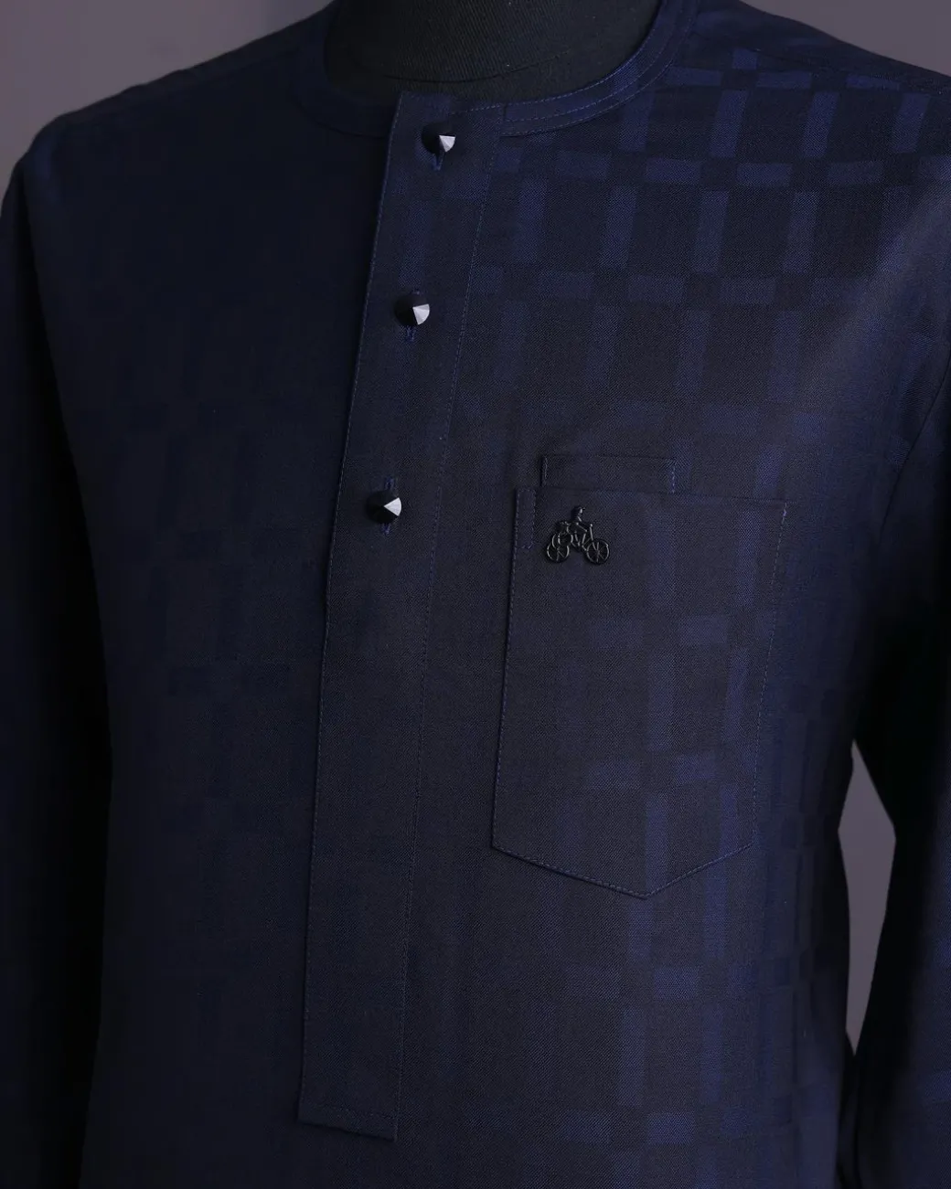 A Midnight blue, broken rectangle and square pattern, jorgecarli, front flap with black Swarovski button, long sleeve African senator kaftan native.