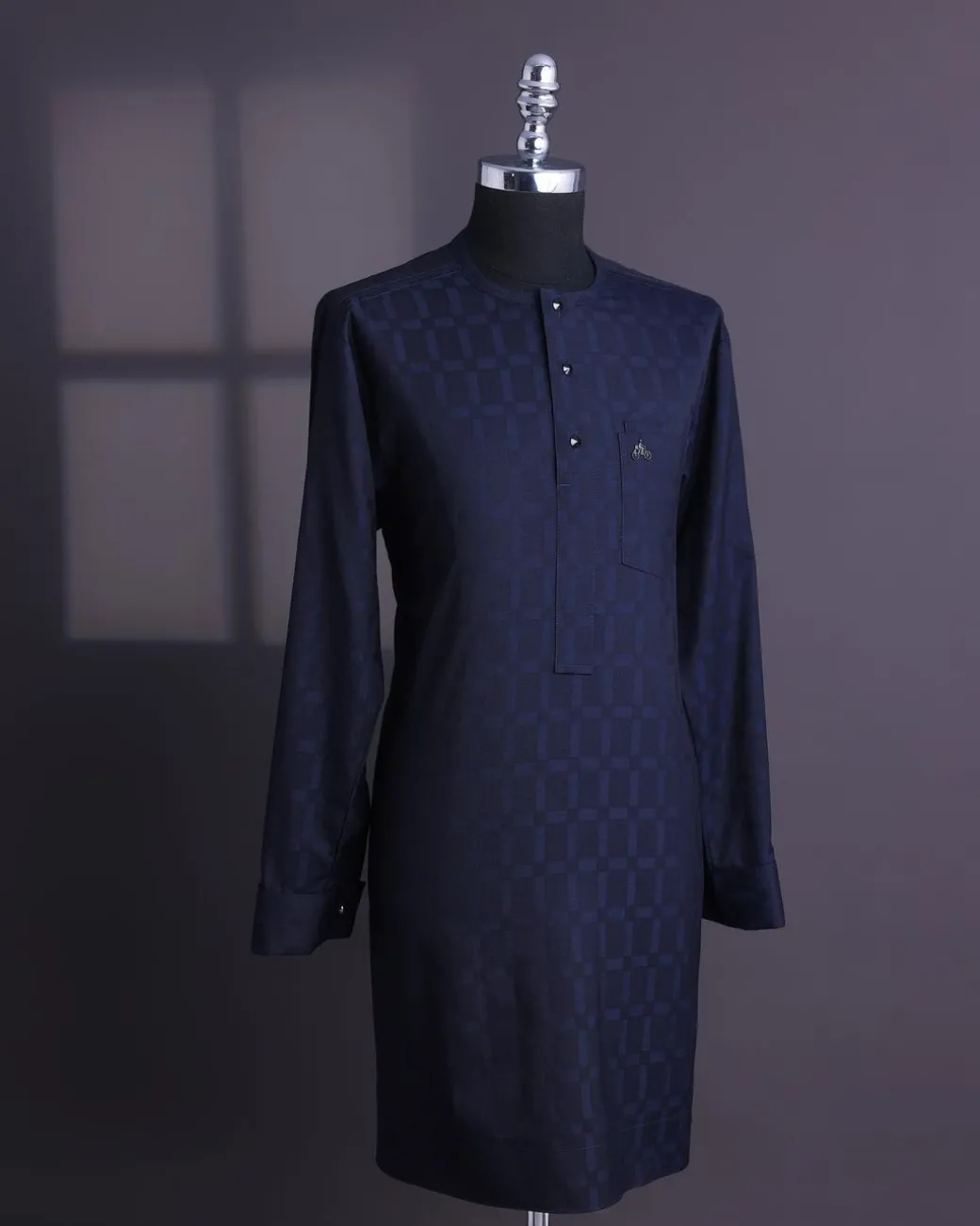 A Midnight blue, broken rectangle and square pattern, jorgecarli, front flap with black Swarovski button, long sleeve African senator kaftan native.