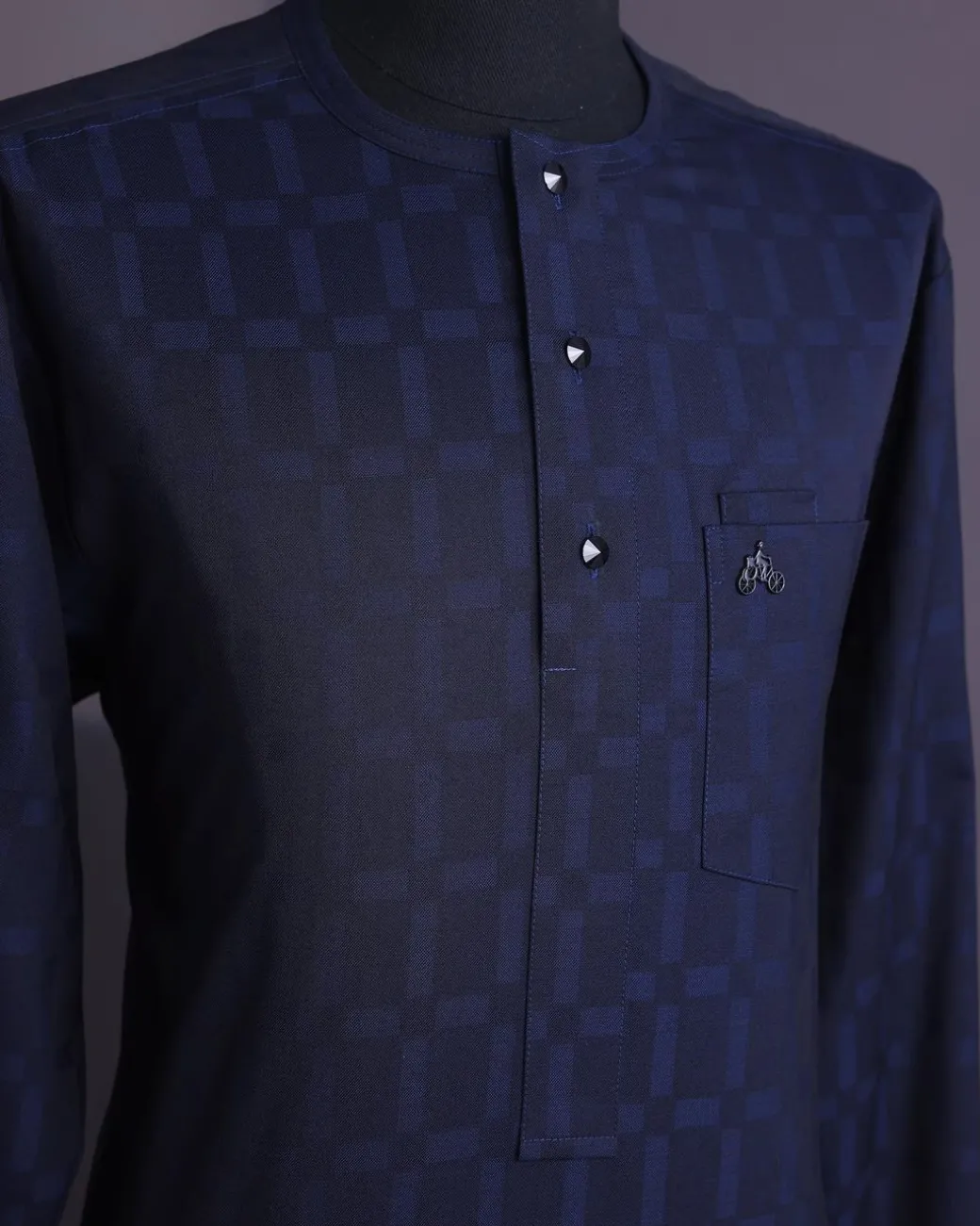 A Midnight blue, broken rectangle and square pattern, jorgecarli, front flap with black Swarovski button, long sleeve African senator kaftan native.