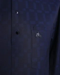 A Midnight blue, broken rectangle and square pattern, jorgecarli, front flap with black Swarovski button, long sleeve African senator kaftan native.