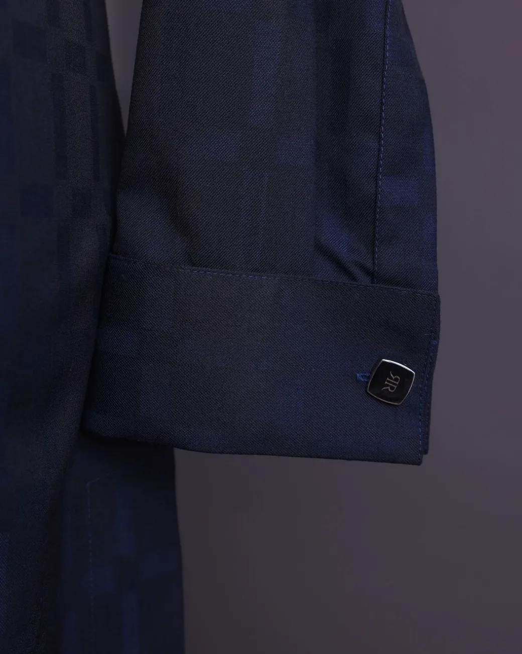 A Midnight blue, broken rectangle and square pattern, jorgecarli, front flap with black Swarovski button, long sleeve African senator kaftan native.