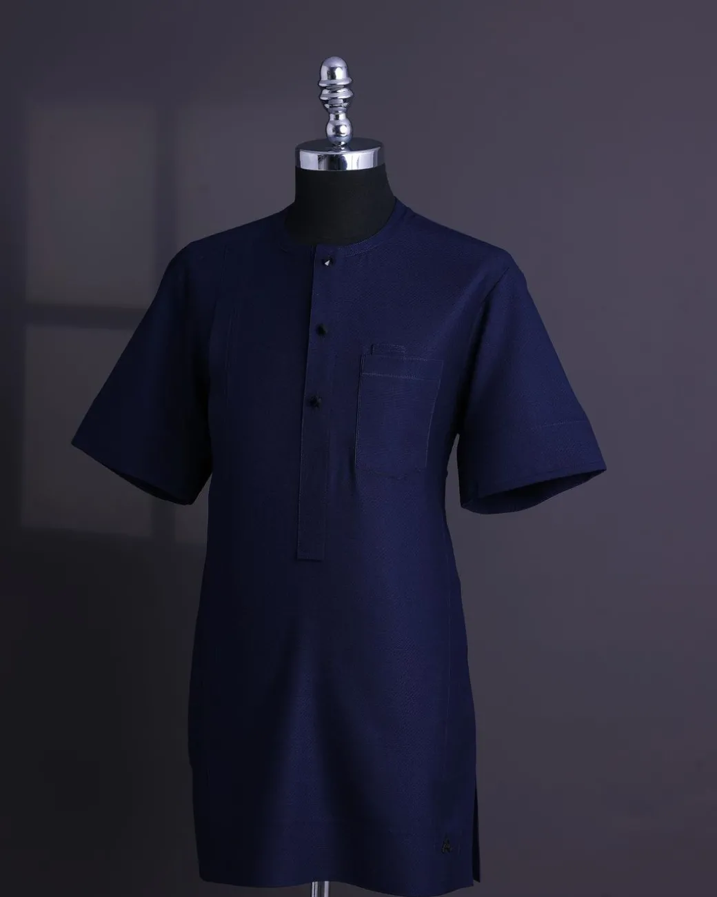 A Midnight blue, broken square pattern, Jorgecarli, front flap with black Swarovski button, 3/4 sleeve African senator Kaftan native.