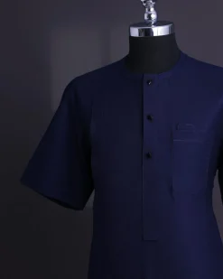 A Midnight blue, broken square pattern, Jorgecarli, front flap with black Swarovski button, 3/4 sleeve African senator Kaftan native.