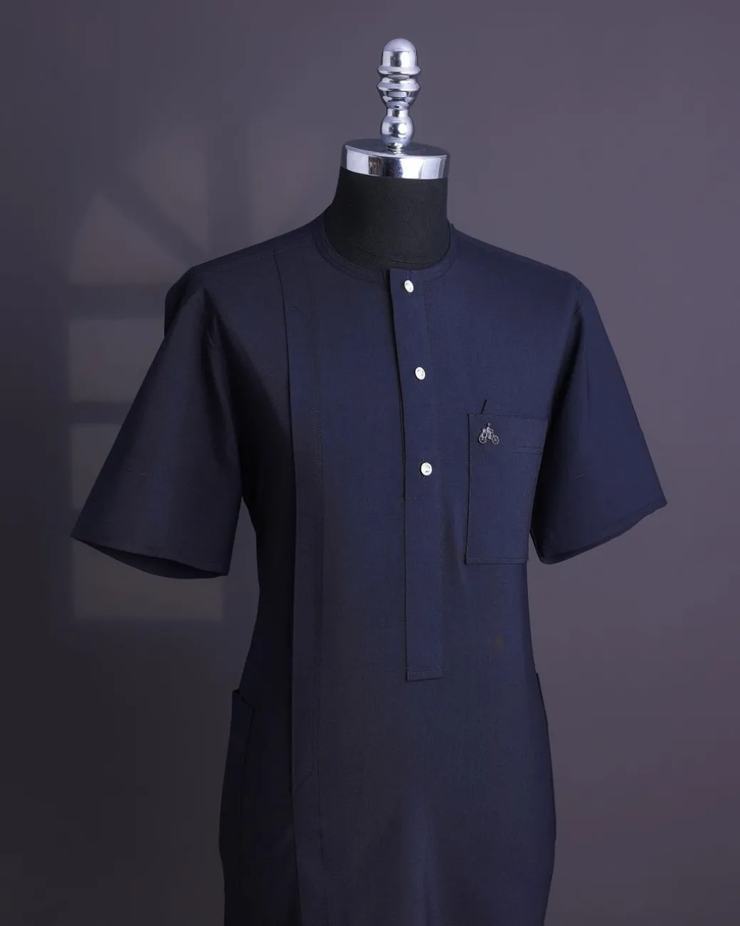 A Midnight blue, brown Aaron wool, front flap with silver Swarovski button, shorts sleeve African senator kaftan native.