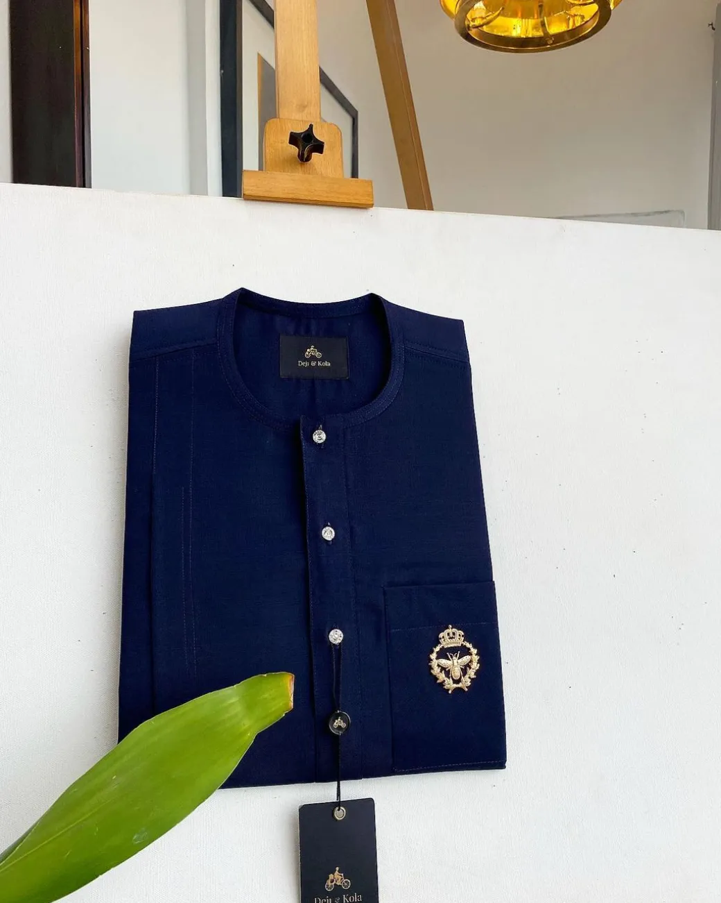 A Midnight Blue, clear view silver Swarovski buttons, gold bee adornment green pocket details African traditional senator kaftan native.