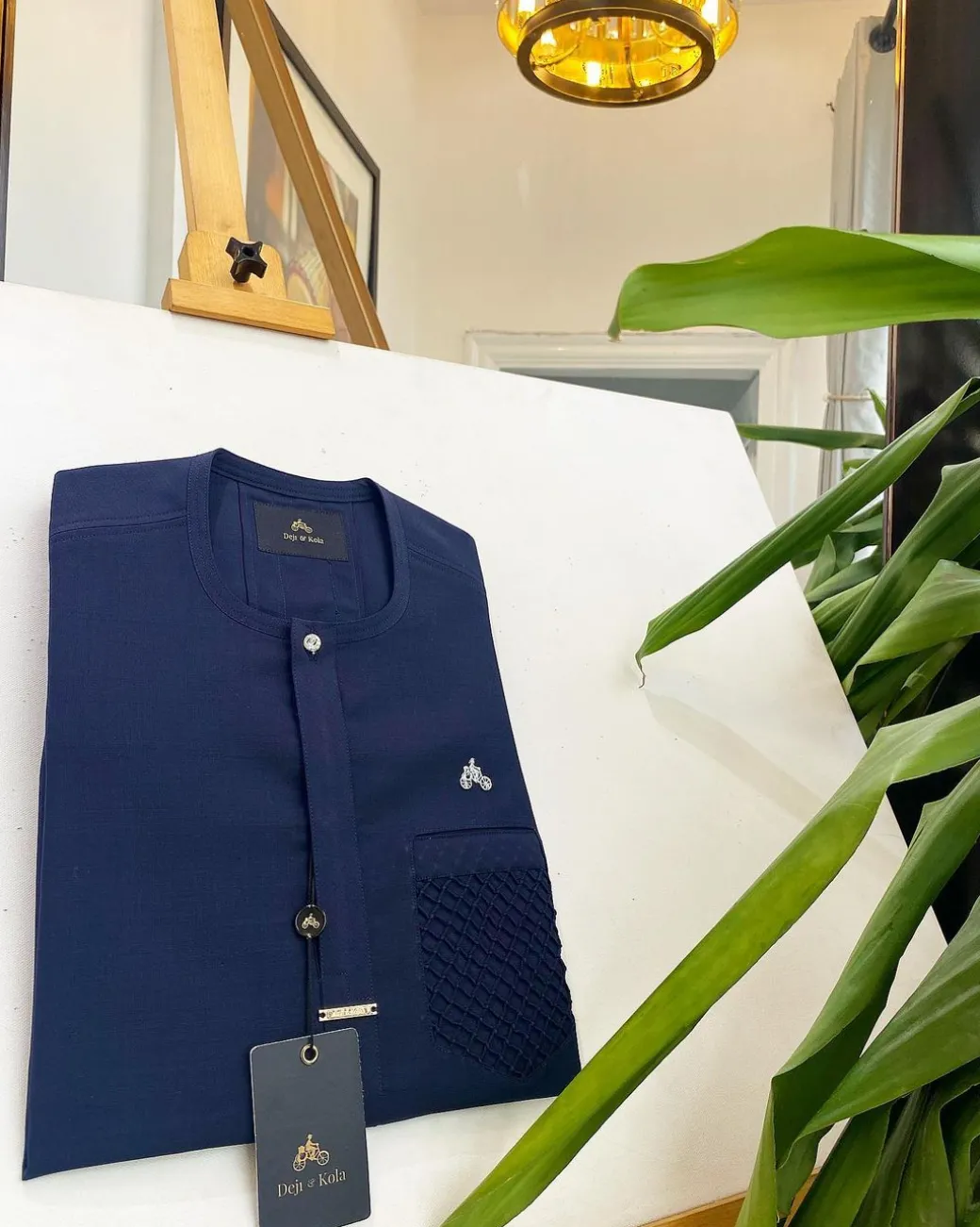 A midnight blue, clear view silver Swarovski buttons and ruffle pocket details African traditional senator kaftan native